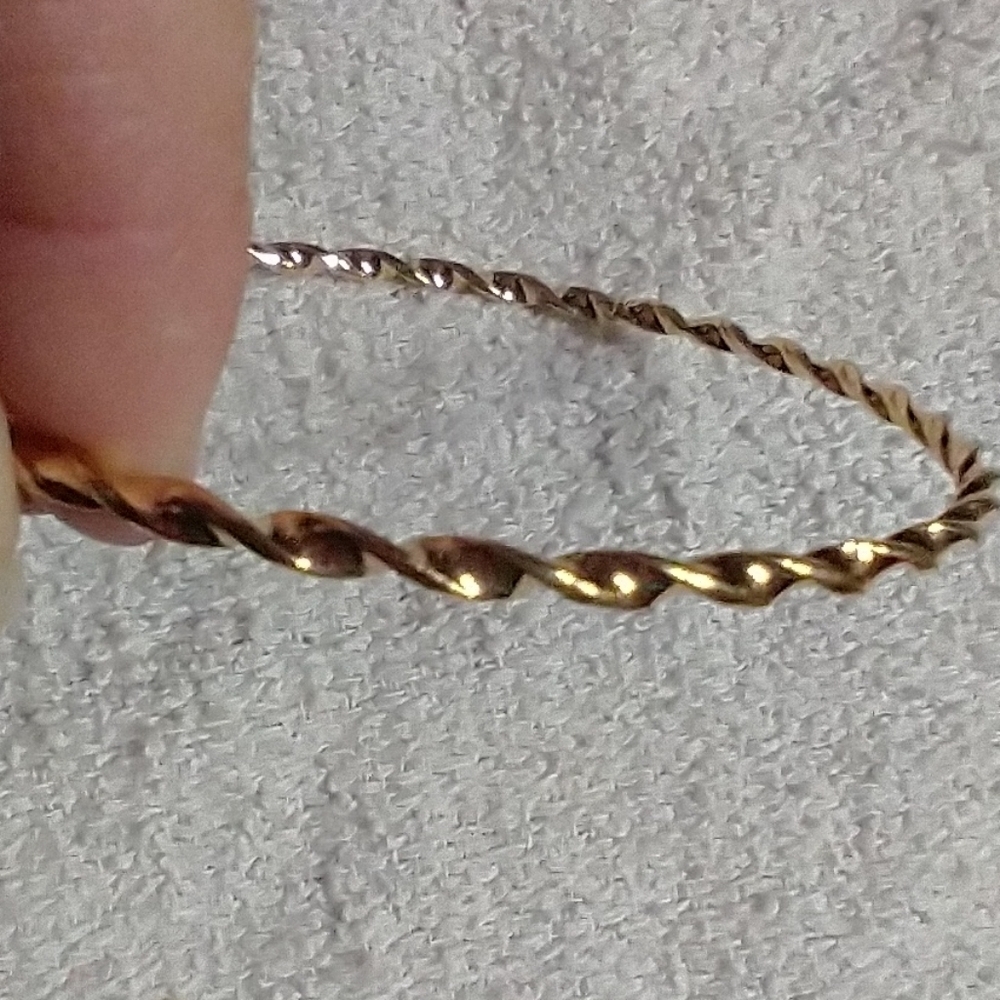 Goldtone twisted Bangle bracelet 2.75 i.d.